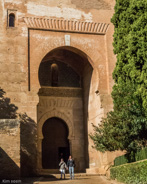 Granada-above the gate carved a hand upraised as though to stop entry, and a key signifying private entrance.