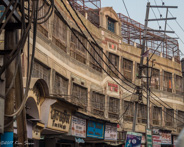Varanasi - Cages on top of buildings and over windows to keep the monkeys out.