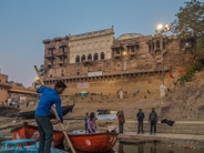 Varanasi: Our boatsman manouvers us away from the other boats.  See the ghat (steps area) and the overlooking houses/hotels.