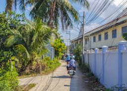 Photo shot while riding with my motor scooter driver - rare area without many people.  It appears that so many houses, businesses, and so much living takes place on these small roads.
