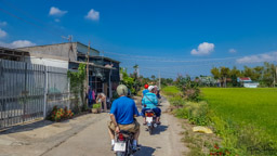 We head to a ag village with our scooter friends.