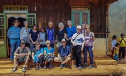 We pose with the chief and his wife.  Note that one of our troup bought the piece she just finished.