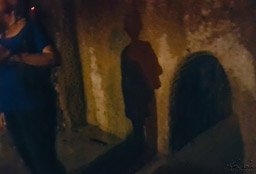One of the underground entries with a person standing nearby for perspective.  I walked through some of them, hunched over and with shoulders squeezed together.  They are narrow and not tall - 