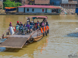 We also stopped at a small village across the river to visit a veteran and his wife, who was making rice paper wrappers.