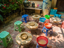 Oh yes, we were invited to try.  My first attempt at potting, I might add.  The wheels were turned by hand.  Mine is the middle one and it won a prize!  Maybe I have a new talent?