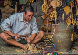 Workman carving interesting designs...
