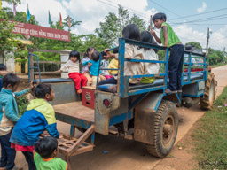 The children take care of each other while parents work the coffee fields.