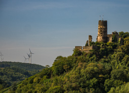 This one is falling apart and clearly hasn't been used for a long time.  Interesting juxtaposition to the modern windmills!  Germany is aggressively moving away from coal and nuclear.