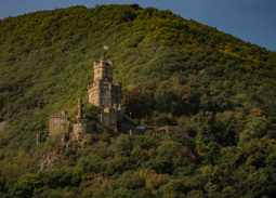 Beautiful castle apparently in use - based on the flag and the van climbing towards it.