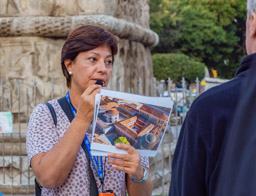 Maria explains the neighborhood's history.