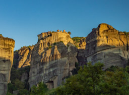 Monastery build into the top of this tower, gleaming in the morning golden sunlight.